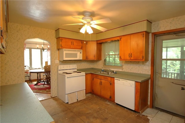 138 Demmel Dr, Peters Twp, PA 15317 - kitchen featuring white appliances, wallpapered walls, ceiling fan, arched walkways, and a chandelier