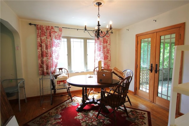 138 Demmel Dr, Peters Twp, PA 15317 - dining space featuring healthy amount of natural light, a chandelier, wood finished floors, and french doors