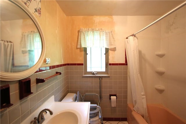 138 Demmel Dr, Peters Twp, PA 15317 - bathroom with tile walls, shower / bathtub combination with curtain, vanity, a wainscoted wall, and tile patterned flooring