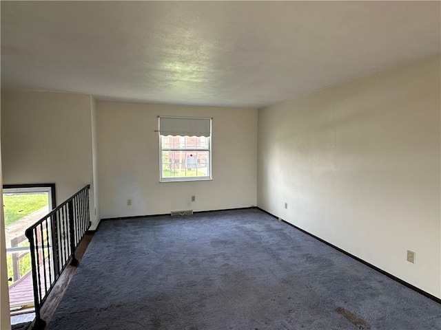 201 N 10th St, Connellsville, PA 15425 - unfurnished room featuring dark carpet and baseboards