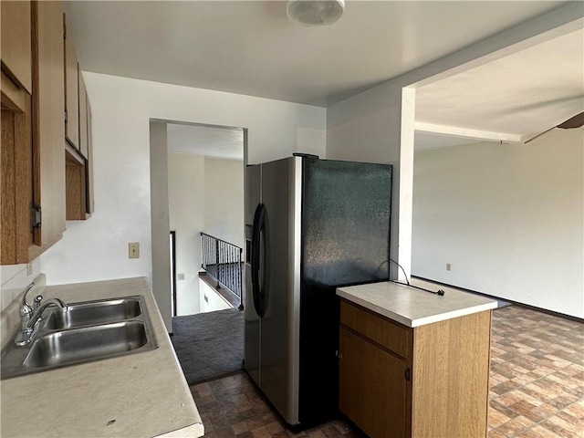 201 N 10th St, Connellsville, PA 15425 - kitchen featuring stainless steel refrigerator with ice dispenser, light countertops, and brick patterned floors