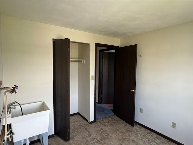201 N 10th St, Connellsville, PA 15425 - unfurnished bedroom featuring baseboards and a closet