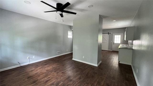 4010 Jane St, West Mifflin, PA 15122 - unfurnished living room with a barn door, ceiling fan, dark wood-type flooring, and recessed lighting