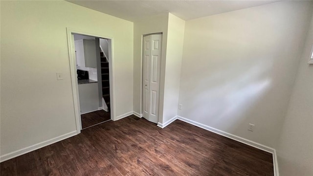 4010 Jane St, West Mifflin, PA 15122 - unfurnished bedroom with dark wood-type flooring and a closet