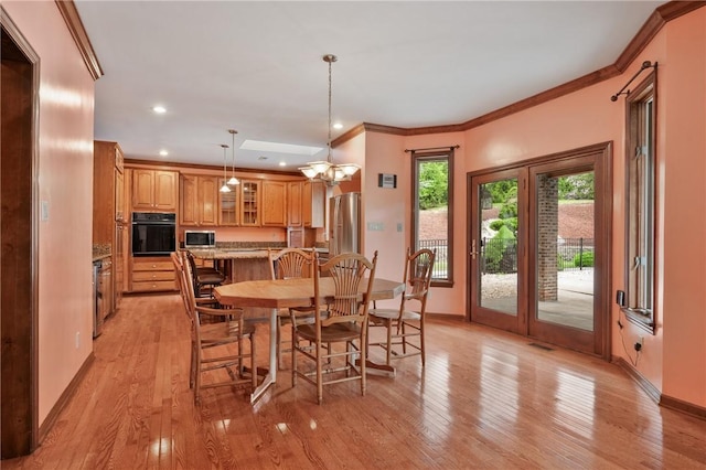 4 Hawthorne Ln, Penn Twp, PA 15642 - dining space featuring light wood finished floors, crown molding, and recessed lighting