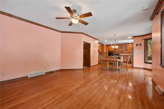 4 Hawthorne Ln, Penn Twp, PA 15642 - living room featuring crown molding, light wood-style floors, ceiling fan, recessed lighting, and a chandelier