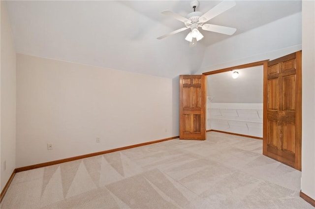 4 Hawthorne Ln, Penn Twp, PA 15642 - unfurnished bedroom featuring lofted ceiling, light carpet, and ceiling fan