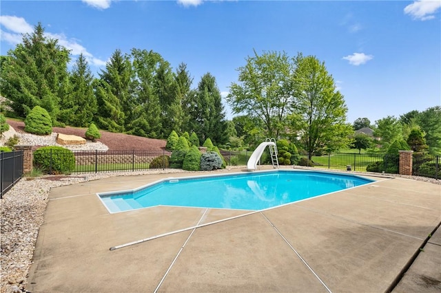 4 Hawthorne Ln, Penn Twp, PA 15642 - view of pool featuring a water slide, a patio area, and view of scattered trees