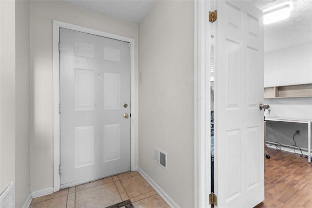 3269 Dawson St, Oakland, PA 15213 - foyer featuring baseboards and a textured ceiling
