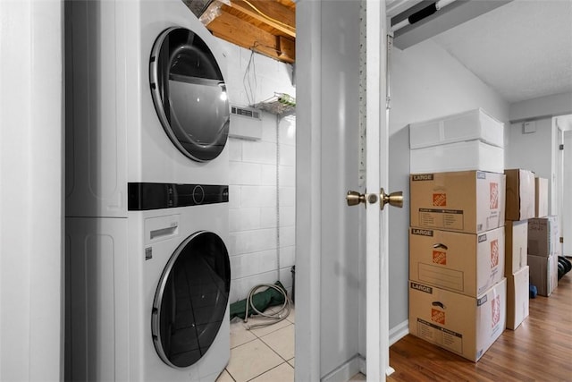 3269 Dawson St, Oakland, PA 15213 - washroom with estacked washer and dryer and wood finished floors