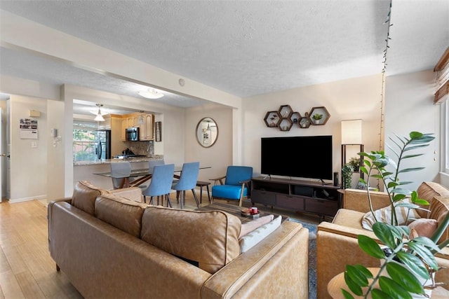 3269 Dawson St, Oakland, PA 15213 - living area with a textured ceiling and light wood finished floors