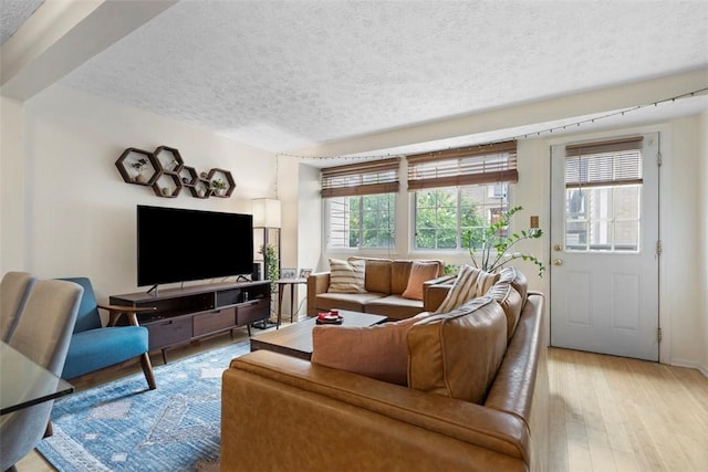 3269 Dawson St, Oakland, PA 15213 - living area with a textured ceiling and light wood-style floors