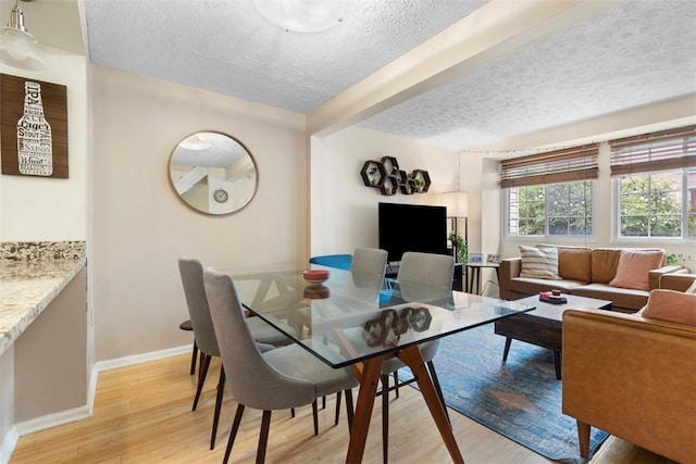 3269 Dawson St, Oakland, PA 15213 - dining space featuring a textured ceiling and light wood-style floors