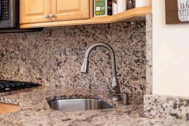 3269 Dawson St, Oakland, PA 15213 - kitchen view of tasteful backsplash, light stone countertops, and light brown cabinets