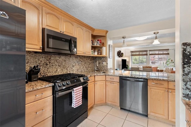 3269 Dawson St, Oakland, PA 15213 - kitchen featuring stainless steel appliances, light brown cabinetry, backsplash, and a textured ceiling