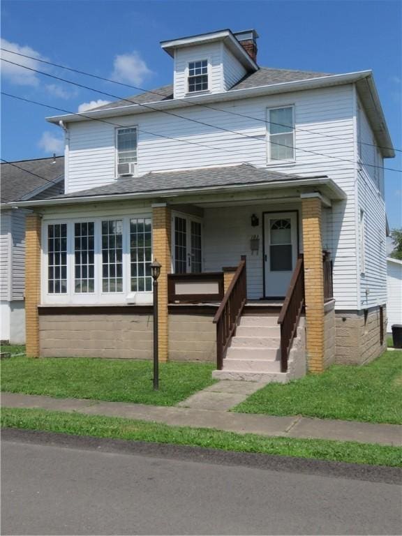103 Cedar St, Masontown, PA 15461 - traditional style home featuring brick siding, a porch, a chimney, and a shingled roof