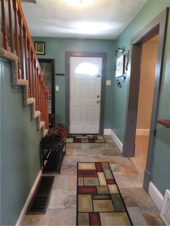 103 Cedar St, Masontown, PA 15461 - foyer featuring stone finish flooring and stairway