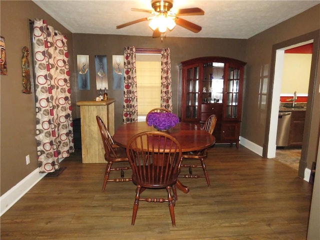 103 Cedar St, Masontown, PA 15461 - dining space with arched walkways, wood finished floors, and a ceiling fan
