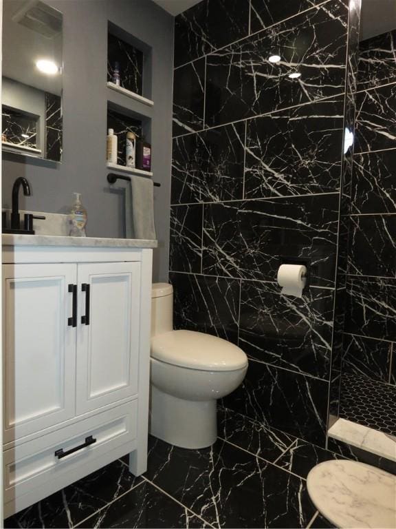 103 Cedar St, Masontown, PA 15461 - bathroom with marble look tile flooring, vanity, and tile walls