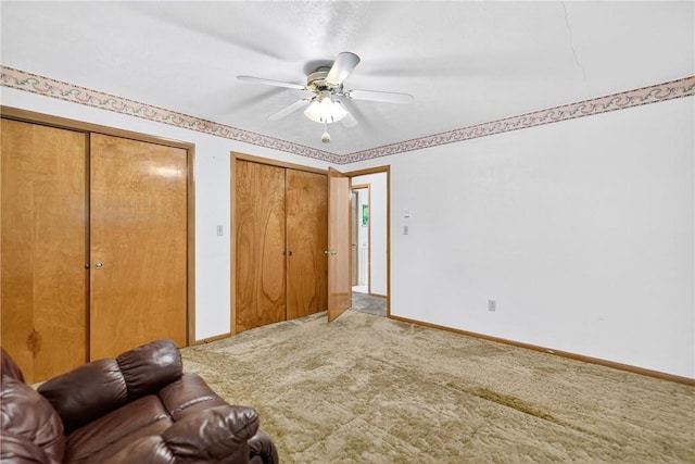 215 Diane Dr, Carroll Twp, PA 15063 - unfurnished bedroom featuring two closets, carpet flooring, and a ceiling fan