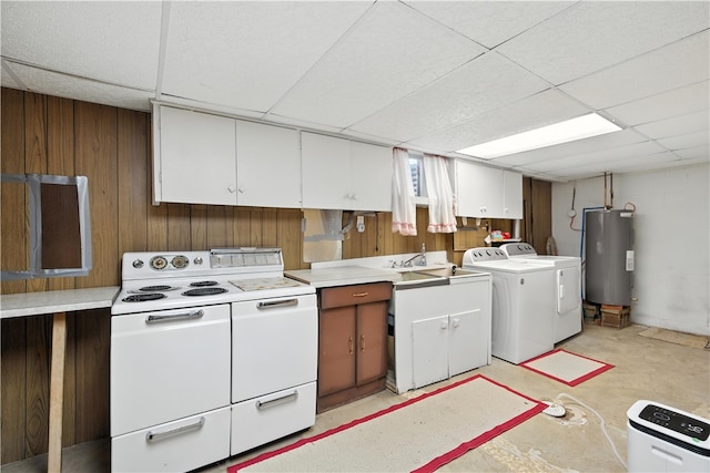 215 Diane Dr, Carroll Twp, PA 15063 - kitchen featuring water heater, a paneled ceiling, separate washer and dryer, white electric range oven, and wooden walls