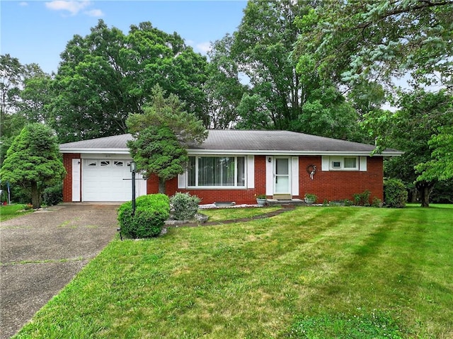 215 Diane Dr, Carroll Twp, PA 15063 - ranch-style house with brick siding, a garage, driveway, and a front lawn