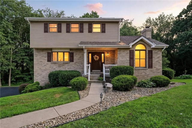 103 Sanger Rd, North Sewickley Twp, PA 15010 - view of front of house featuring brick siding, a front lawn, and a chimney