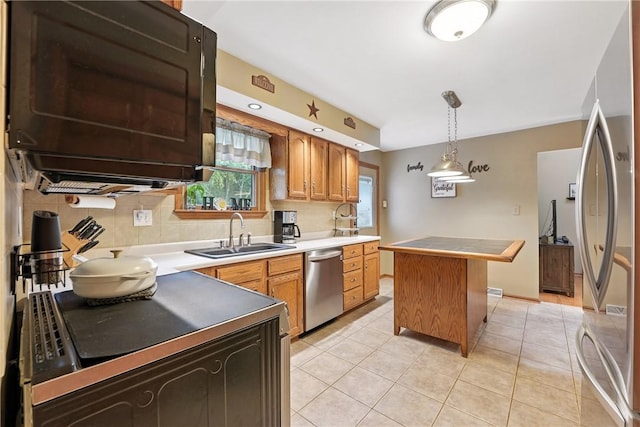 103 Sanger Rd, North Sewickley Twp, PA 15010 - kitchen featuring appliances with stainless steel finishes, light tile patterned flooring, decorative backsplash, and a center island