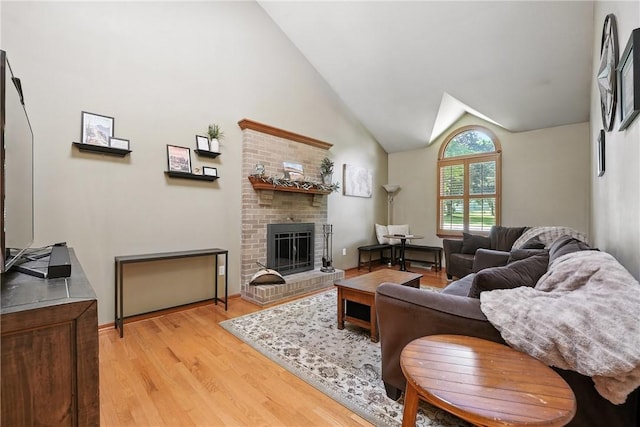 103 Sanger Rd, North Sewickley Twp, PA 15010 - living area featuring light wood finished floors, a brick fireplace, and high vaulted ceiling
