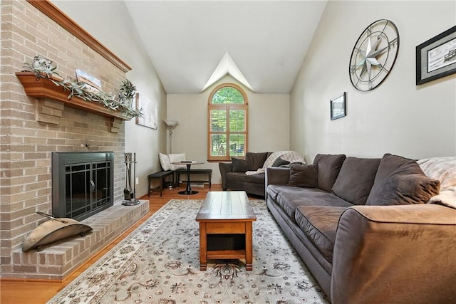 103 Sanger Rd, North Sewickley Twp, PA 15010 - living area featuring wood finished floors, vaulted ceiling, and a fireplace