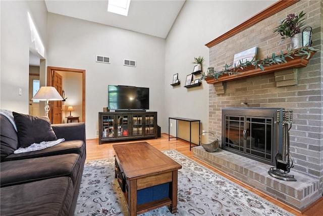 103 Sanger Rd, North Sewickley Twp, PA 15010 - living area featuring high vaulted ceiling, wood finished floors, and a fireplace