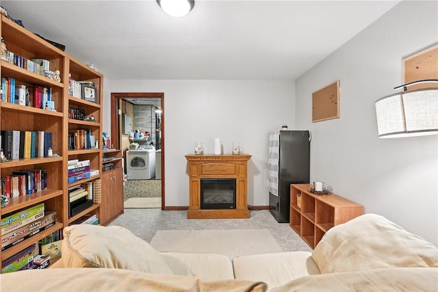 103 Sanger Rd, North Sewickley Twp, PA 15010 - living area with washer / dryer, light carpet, and a glass covered fireplace