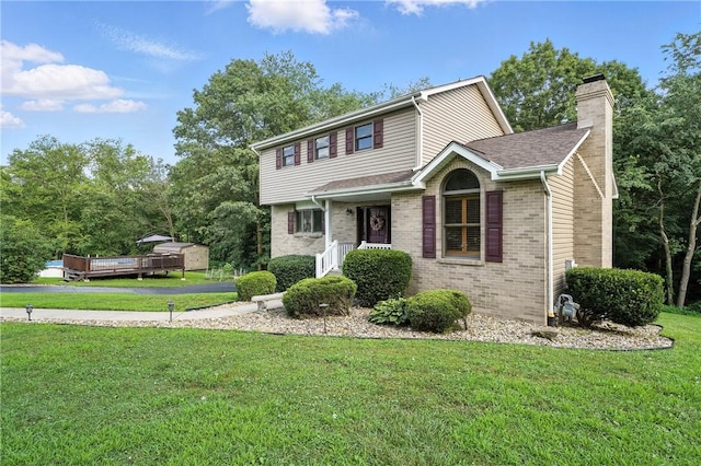 103 Sanger Rd, North Sewickley Twp, PA 15010 - view of front facade featuring a chimney, brick siding, a front yard, and roof with shingles