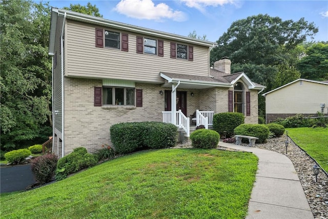 103 Sanger Rd, North Sewickley Twp, PA 15010 - view of front of home featuring brick siding, a front yard, and a chimney