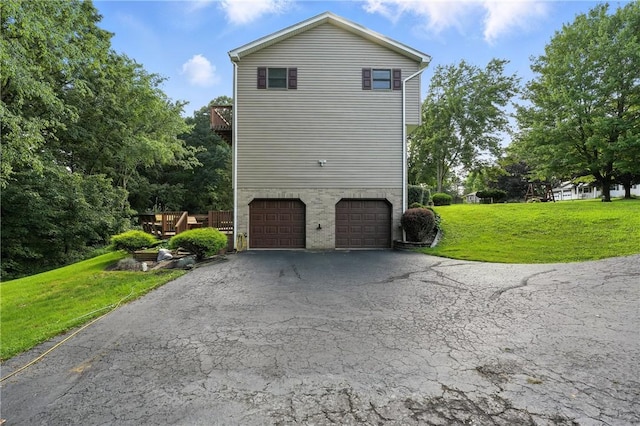 103 Sanger Rd, North Sewickley Twp, PA 15010 - view of property exterior featuring a garage, a yard, driveway, and a balcony