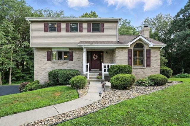 103 Sanger Rd, North Sewickley Twp, PA 15010 - view of front of house featuring brick siding, a front lawn, and a chimney