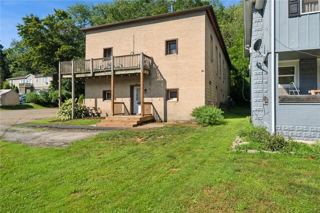 15 Old Saxonburg Blvd, West Deer, PA 15084 - rear view of house with a yard, brick siding, and a balcony