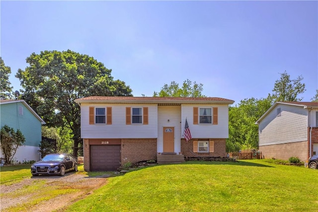 2128 Stoops Ct, Apollo Boro, PA 15673 - bi-level home featuring a garage, brick siding, and driveway