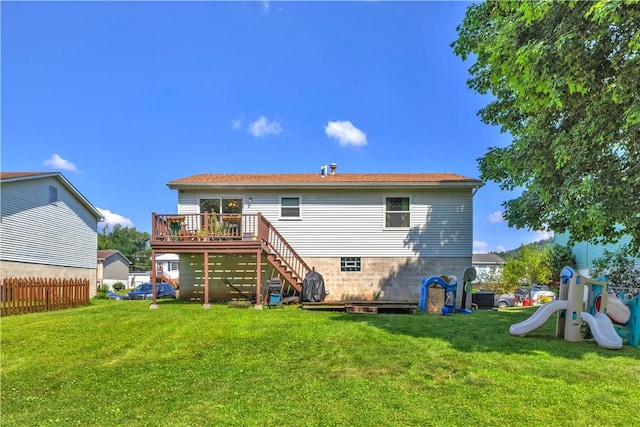 2128 Stoops Ct, Apollo Boro, PA 15673 - rear view of house with stairway, a wooden deck, and a playground
