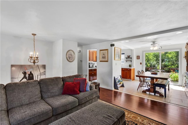 2128 Stoops Ct, Apollo Boro, PA 15673 - living room featuring light wood-style floors, a ceiling fan, and a chandelier
