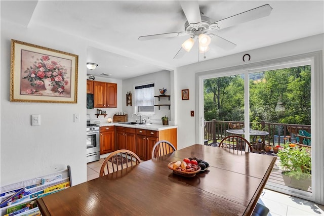 2128 Stoops Ct, Apollo Boro, PA 15673 - dining space with light tile patterned floors and a ceiling fan