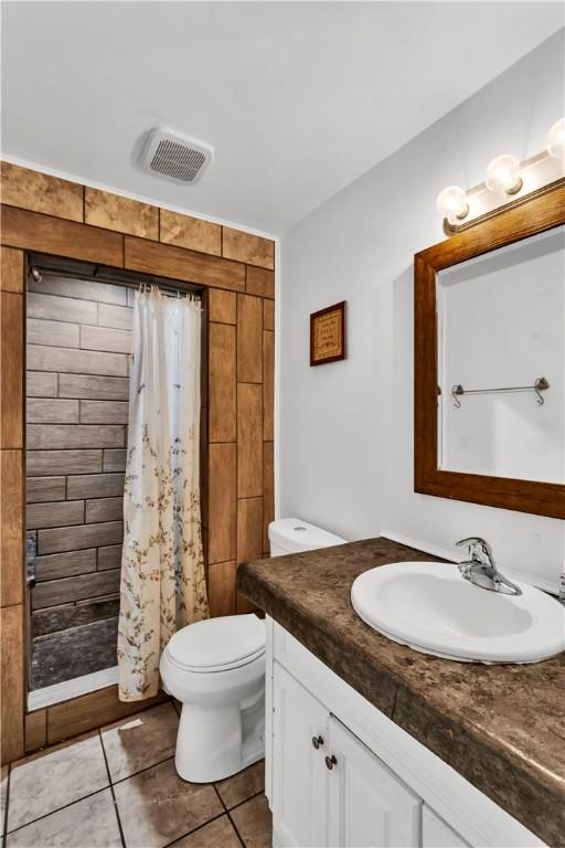 2128 Stoops Ct, Apollo Boro, PA 15673 - full bath featuring vanity, a stall shower, and tile patterned floors