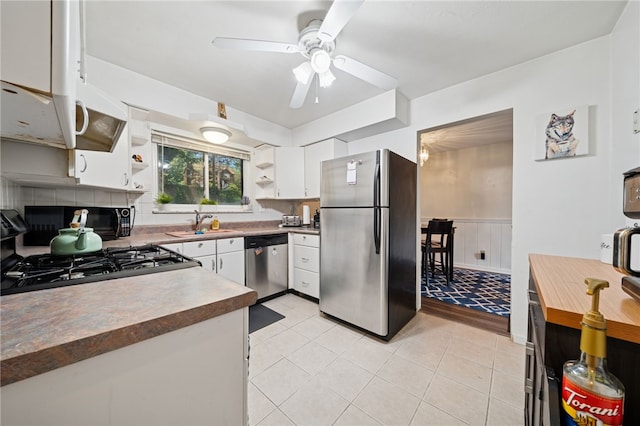 4075 Greensburg Pike, Wilkins Twp, PA 15221 - kitchen with appliances with stainless steel finishes, open shelves, ceiling fan, white cabinetry, and a wainscoted wall