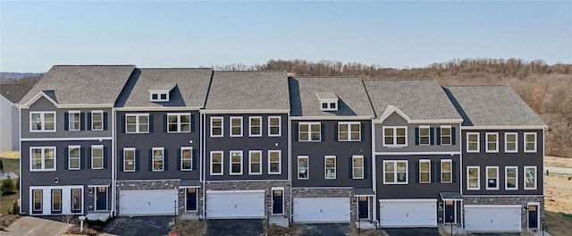 211 Truth Cir, Jackson Twp, PA 16037 - view of front of home with stone siding, a garage, and driveway