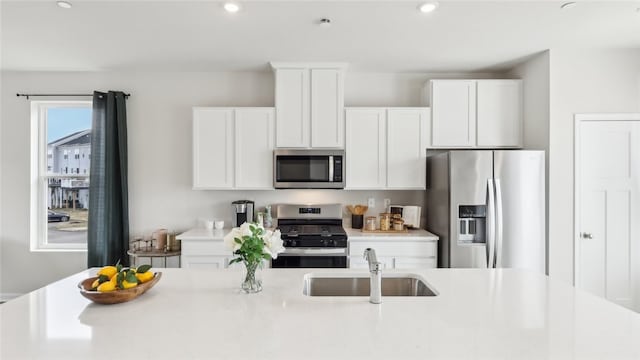 211 Truth Cir, Jackson Twp, PA 16037 - kitchen with appliances with stainless steel finishes, white cabinetry, light countertops, and recessed lighting
