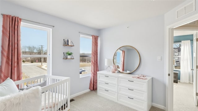 211 Truth Cir, Jackson Twp, PA 16037 - bedroom featuring light colored carpet, multiple windows, and a nursery area