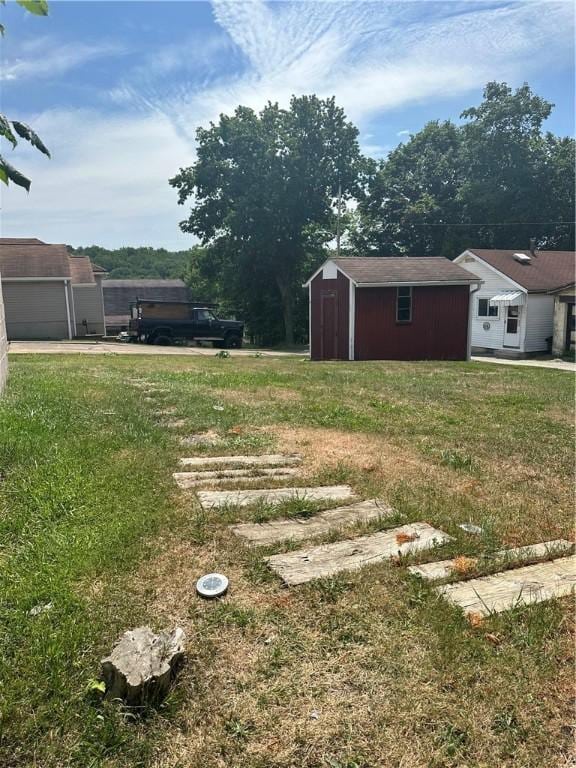 1634 Beech Ave, Turtle Creek, PA 15145 - view of green lawn featuring a storage unit and a garage