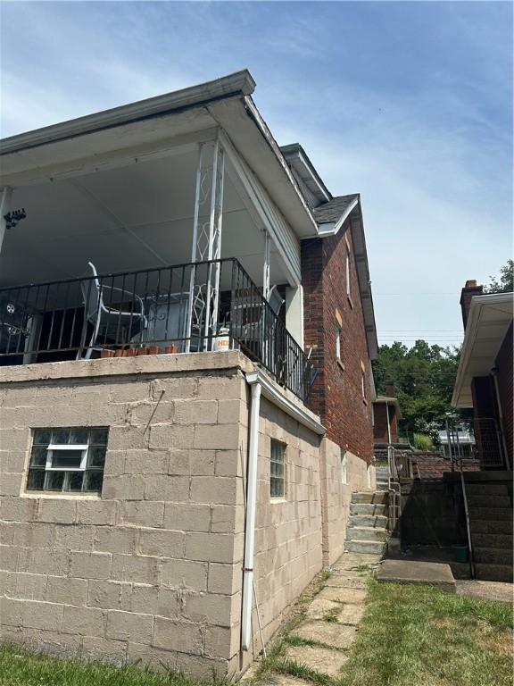 1634 Beech Ave, Turtle Creek, PA 15145 - view of home's exterior featuring a balcony and stairs
