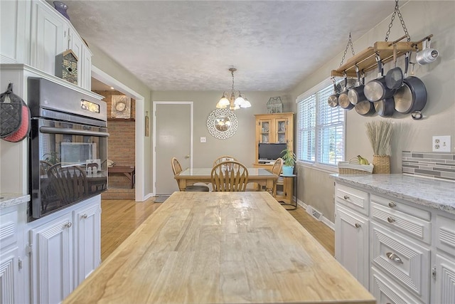 2 Redgrave Dr, Hempfield Twp, PA 15601 - dining space featuring a chandelier and light wood-style flooring