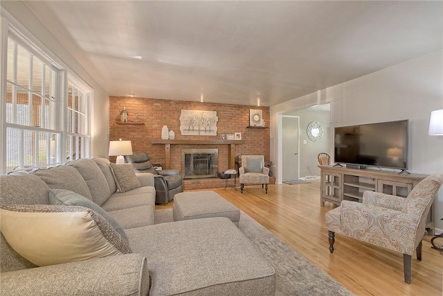 2 Redgrave Dr, Hempfield Twp, PA 15601 - living room with light wood-style floors and a brick fireplace